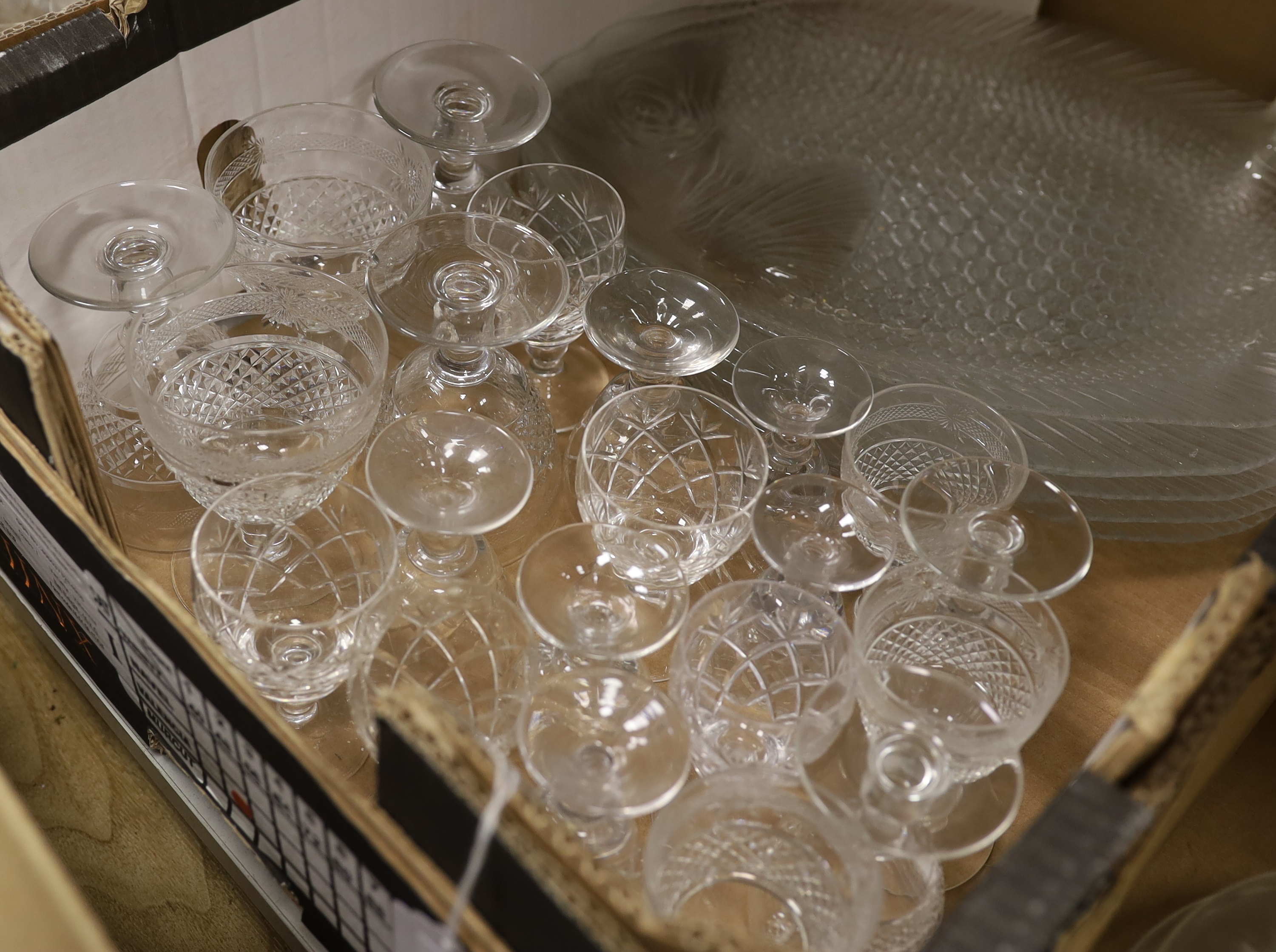 A quantity of mixed cut and moulded glass including beakers, bowls and a set of six fish shaped serving platters (approx 78)